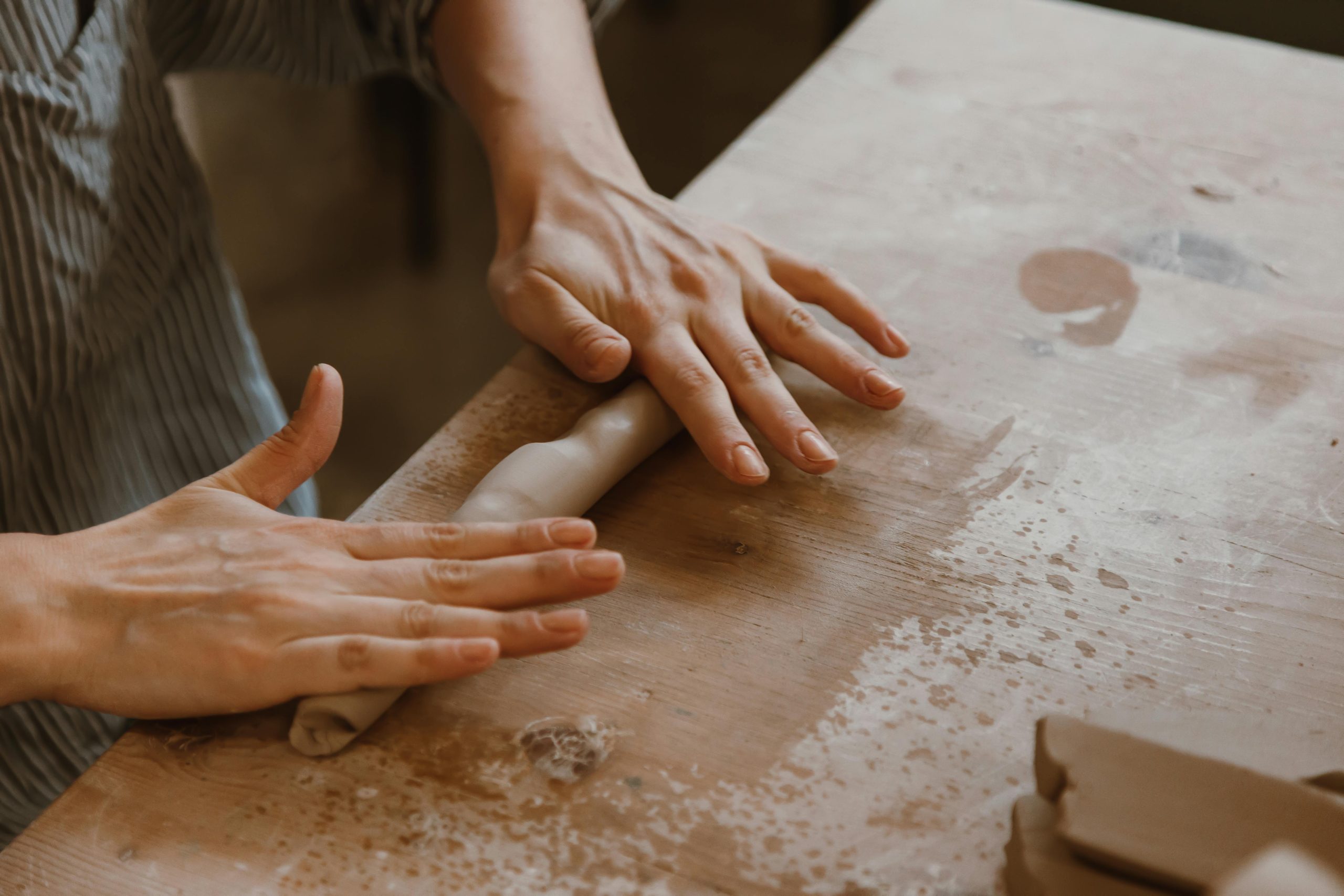 Person kneading clay at Dartmoor Makers community pottery studio